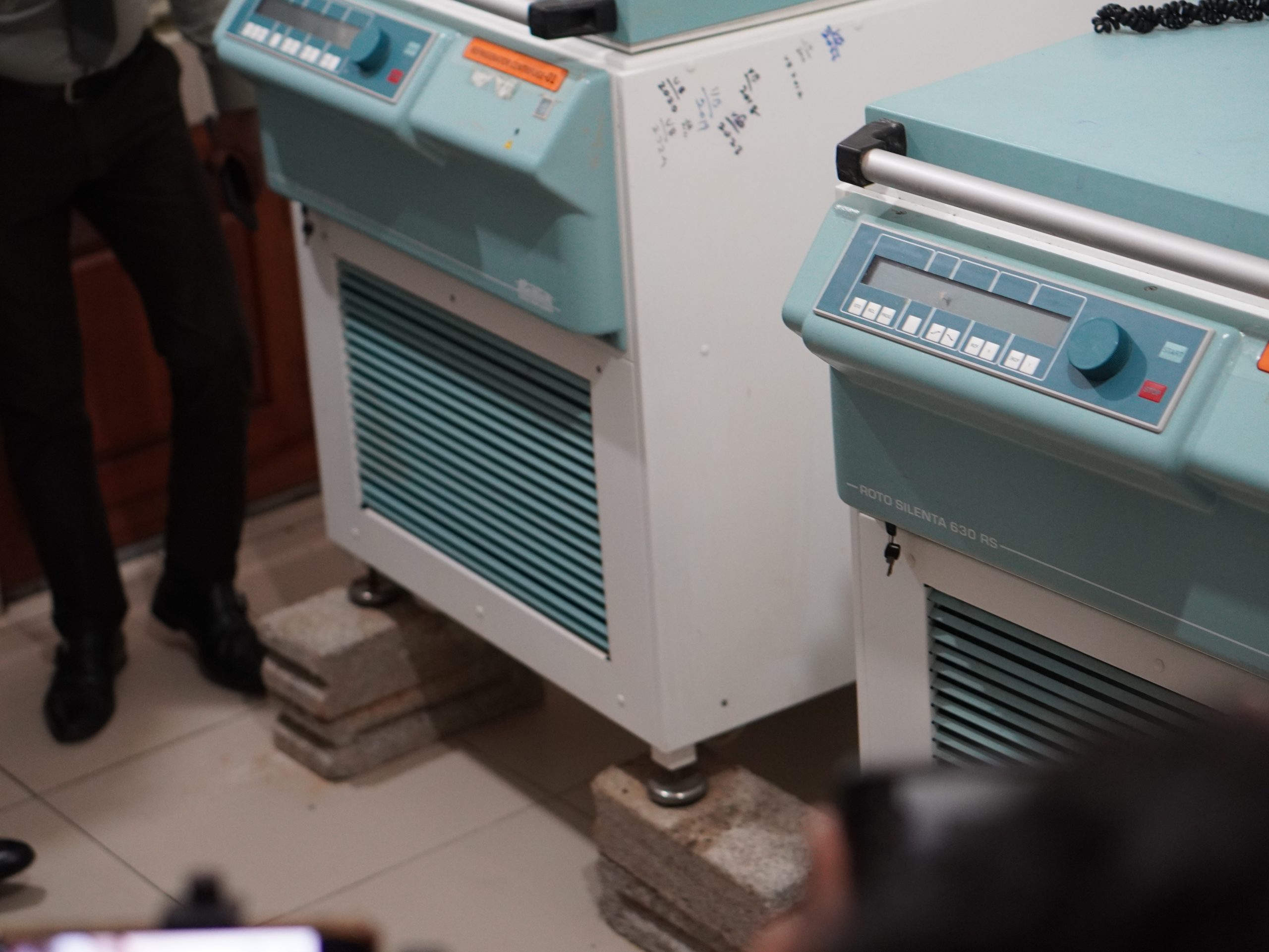 Blood component centrifuge machines caught to floods. They were lifted with rocks to save the machines. But the water level exceeded their efforts.